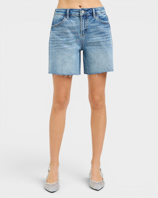 Light blue denim shorts worn by a person on a white background