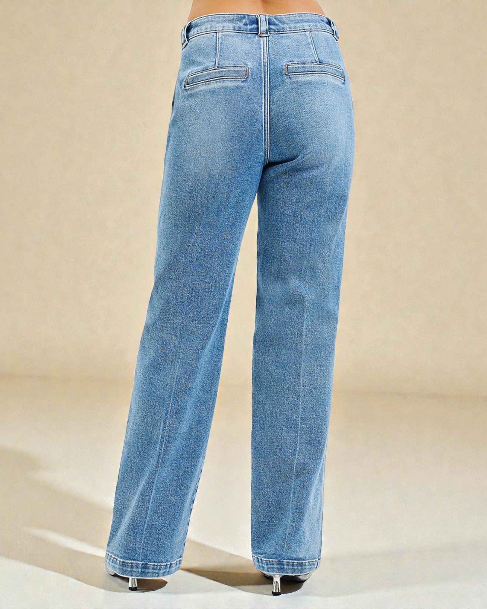 Blue jeans on a beige background