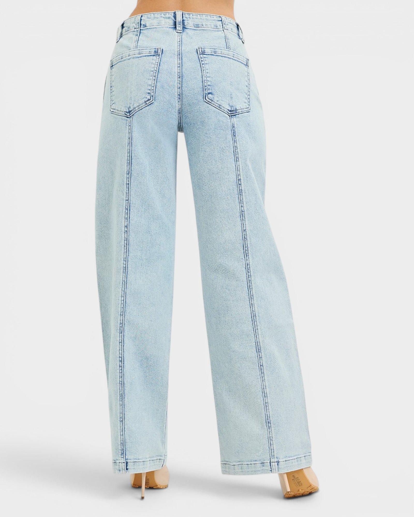 Light blue jeans worn by a person on a white background