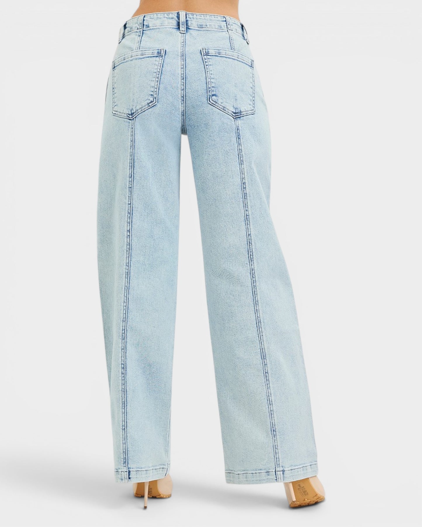 Light blue jeans worn by a person on a white background