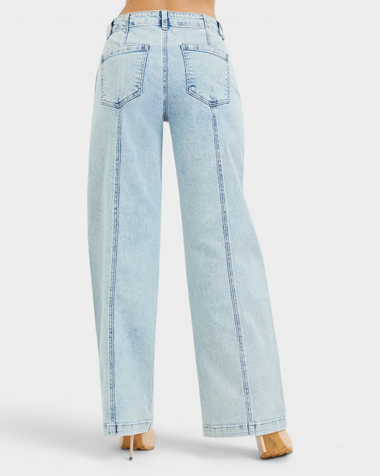 Light blue jeans worn by a person on a white background