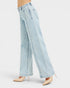 Light blue wide-leg jeans worn by a person on a white background