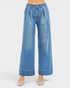 Wide-leg blue jeans on a white background