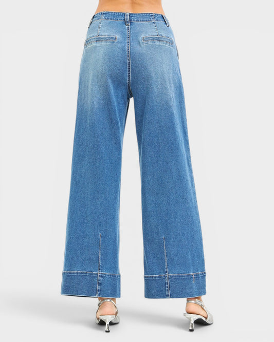 Wide-leg blue jeans on a white background