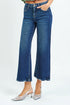 Blue jeans worn by a person on a white background