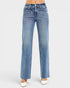 Blue jeans worn by a person on a white background