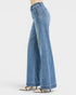 Blue jeans worn by a person on a white background