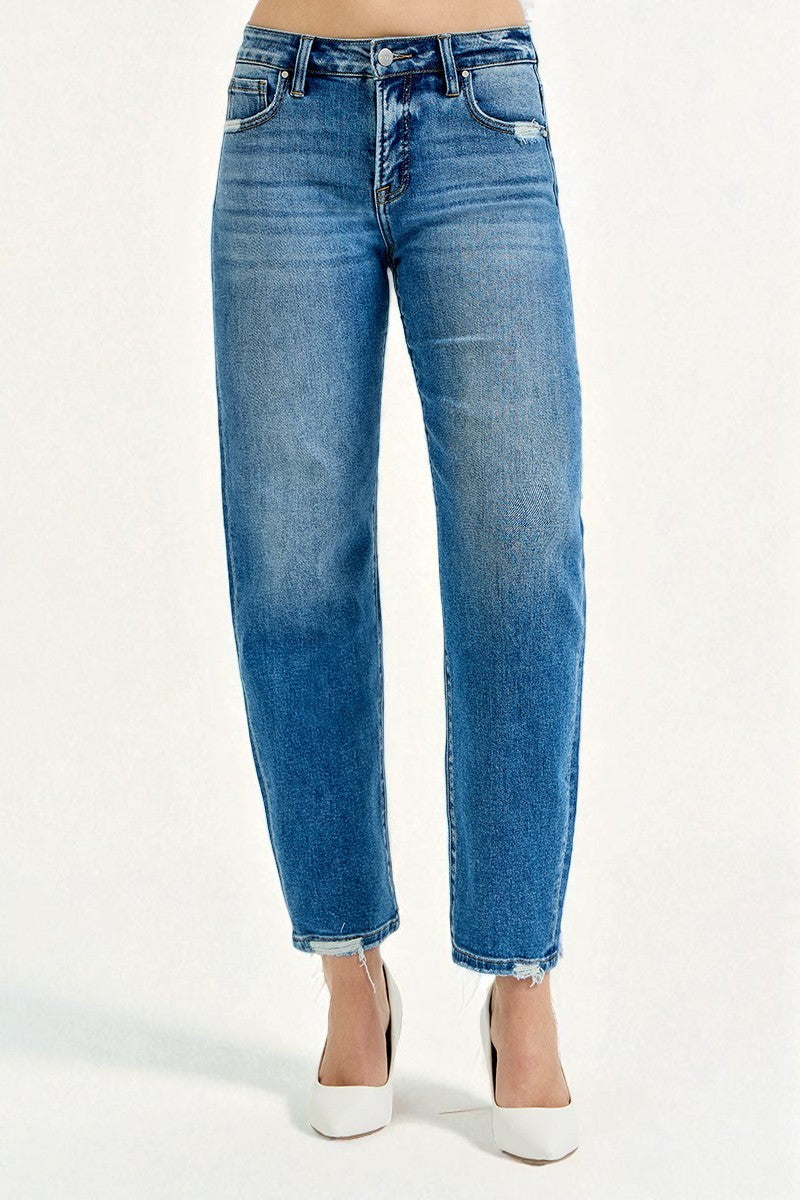 Blue jeans worn by a person on a white background