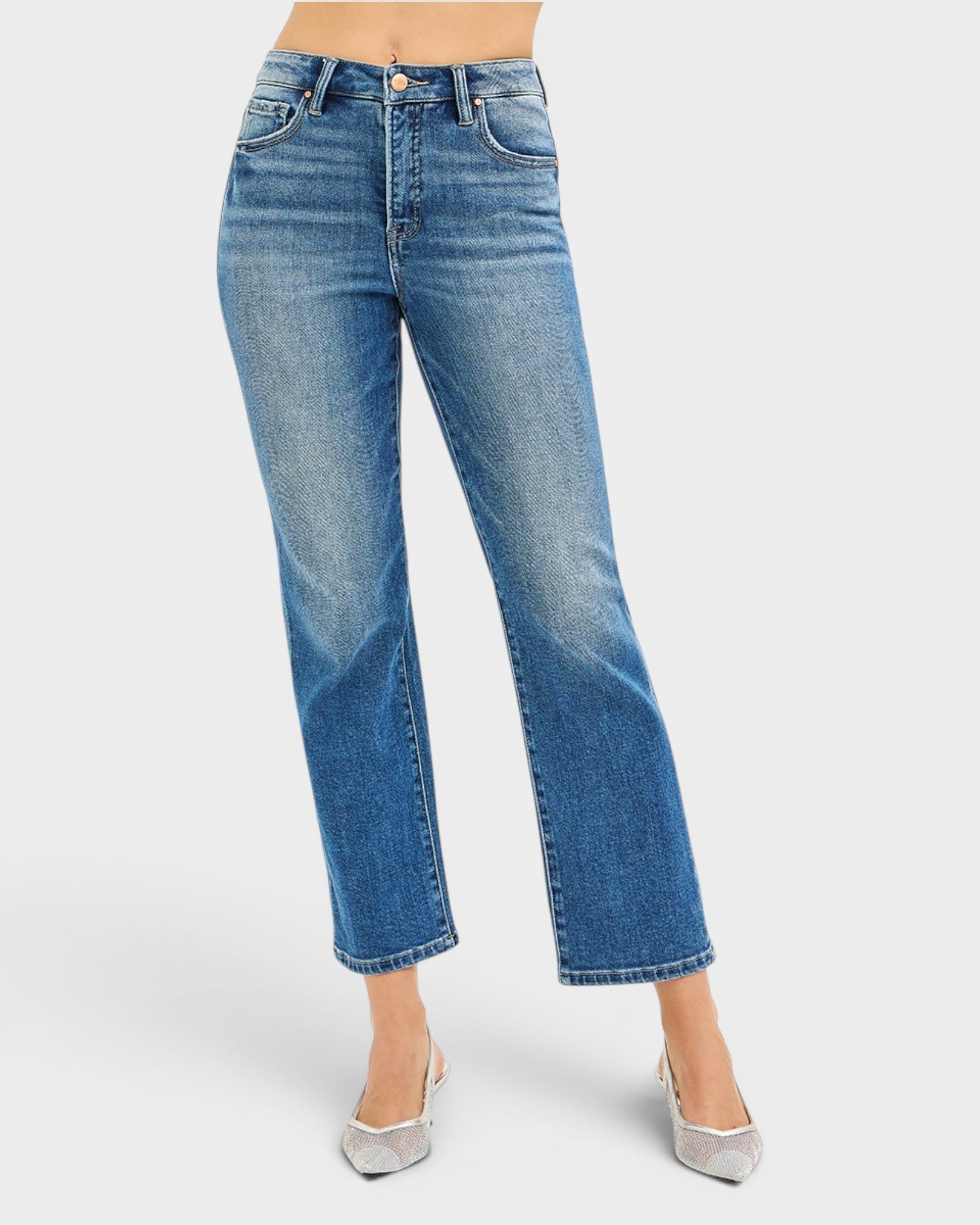 Blue jeans worn by a person on a white background