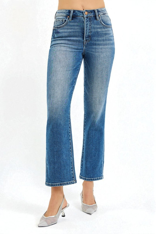 Blue jeans worn by a person on a white background