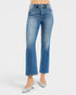 Blue jeans worn by a person on a white background