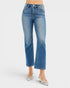 Blue jeans worn by a person on a white background