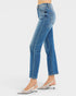 Blue jeans worn by a person on a white background