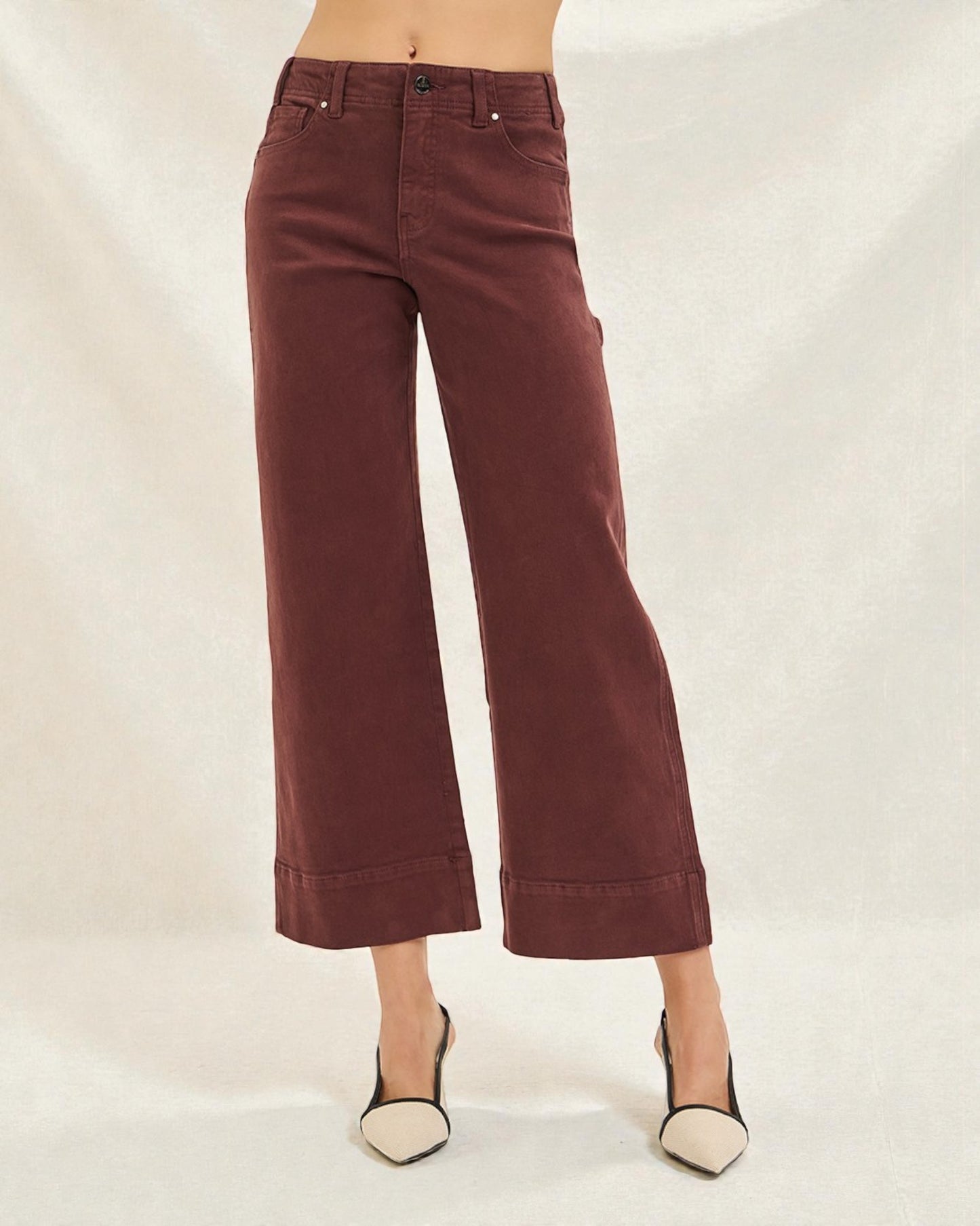 Maroon wide-leg pants worn by a person on a plain background