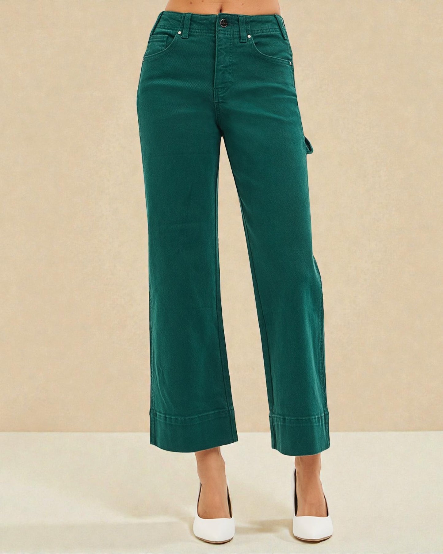 Green pants on a beige background
