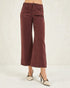 Brown wide-leg pants worn by a person on a white background
