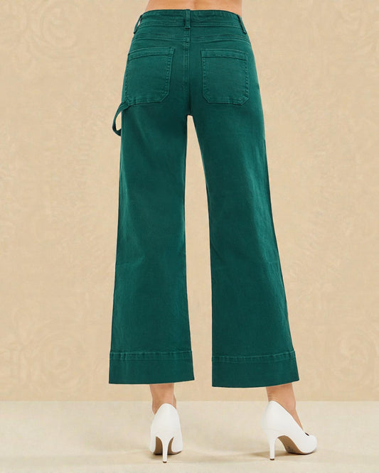 Green wide-leg pants on a beige background