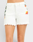 White denim shorts with floral print on a plain background
