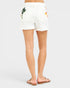 White shorts with floral print worn by a person on a white background
