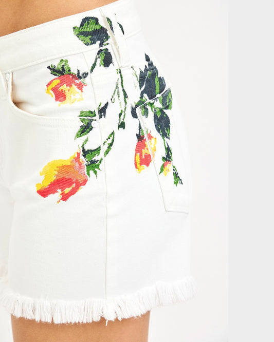 White shorts with colorful floral print on a white background