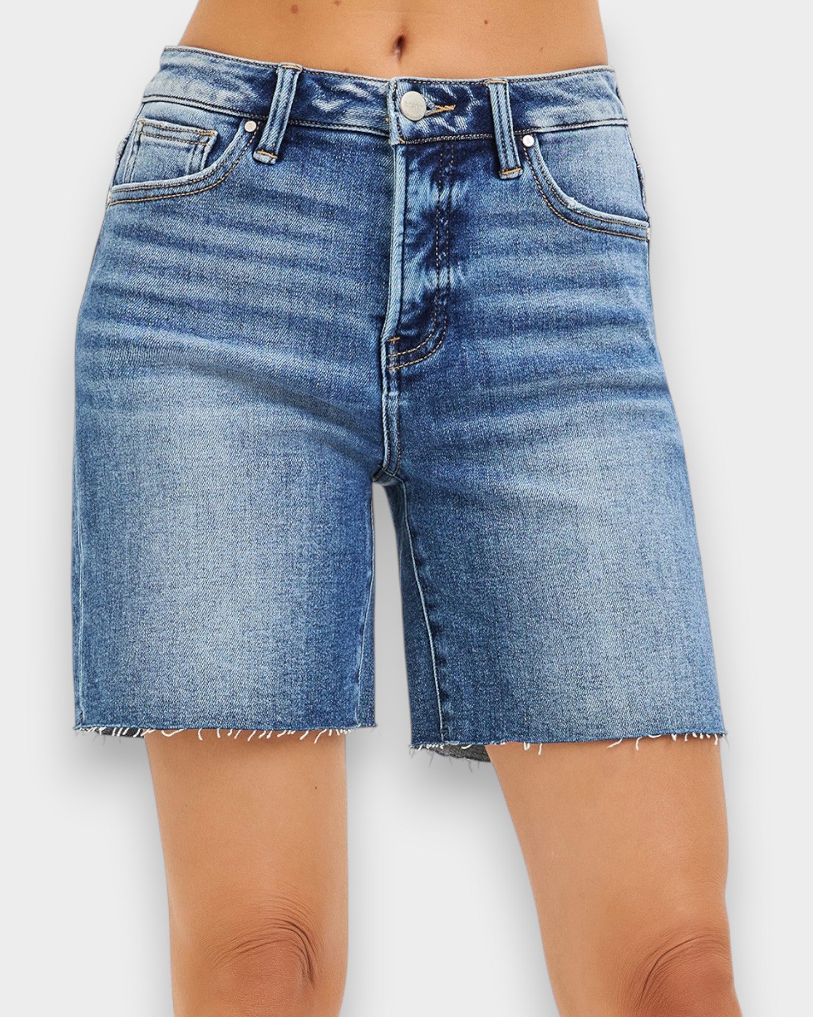 Blue denim shorts on a white background