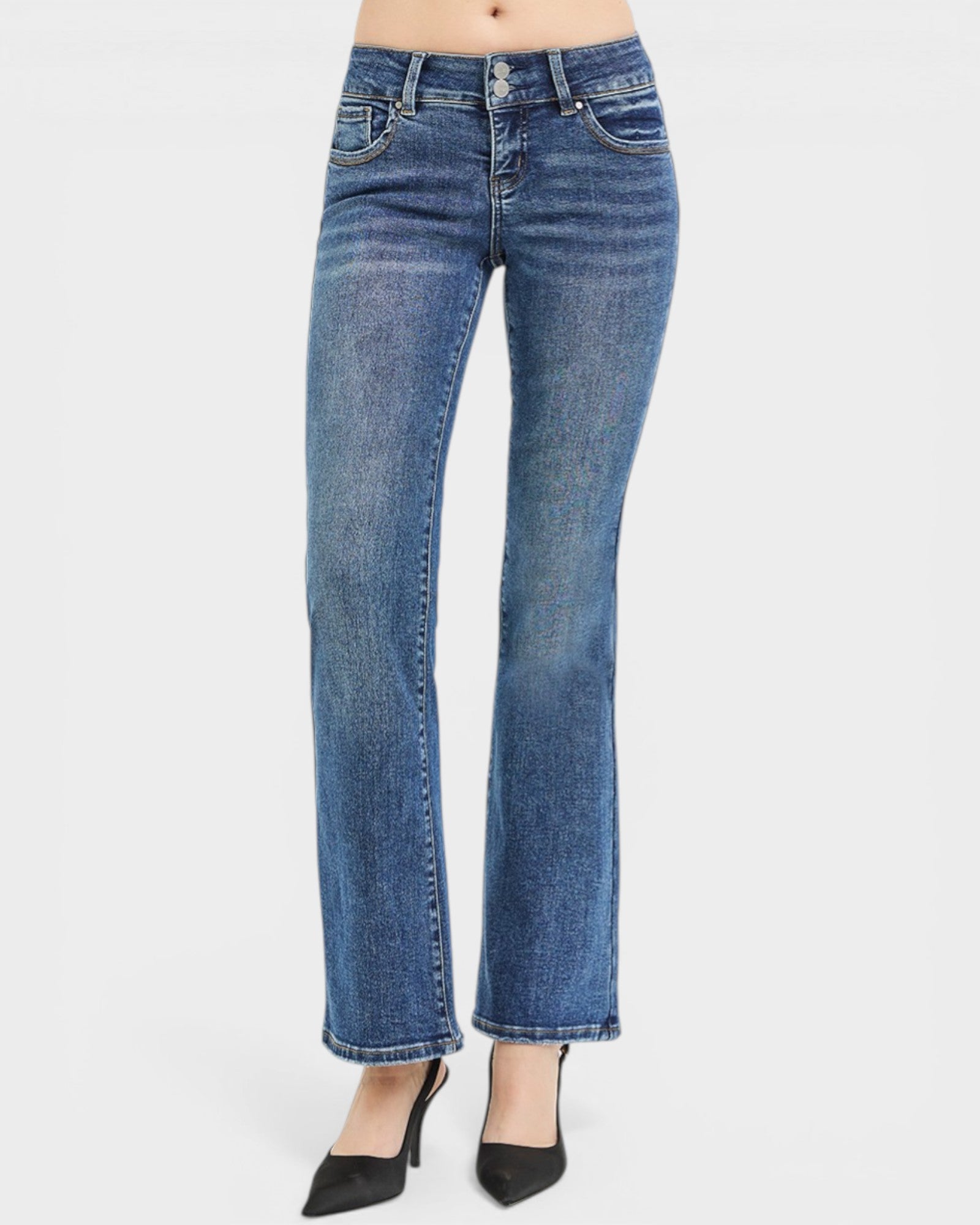 Blue jeans worn by a person on a white background