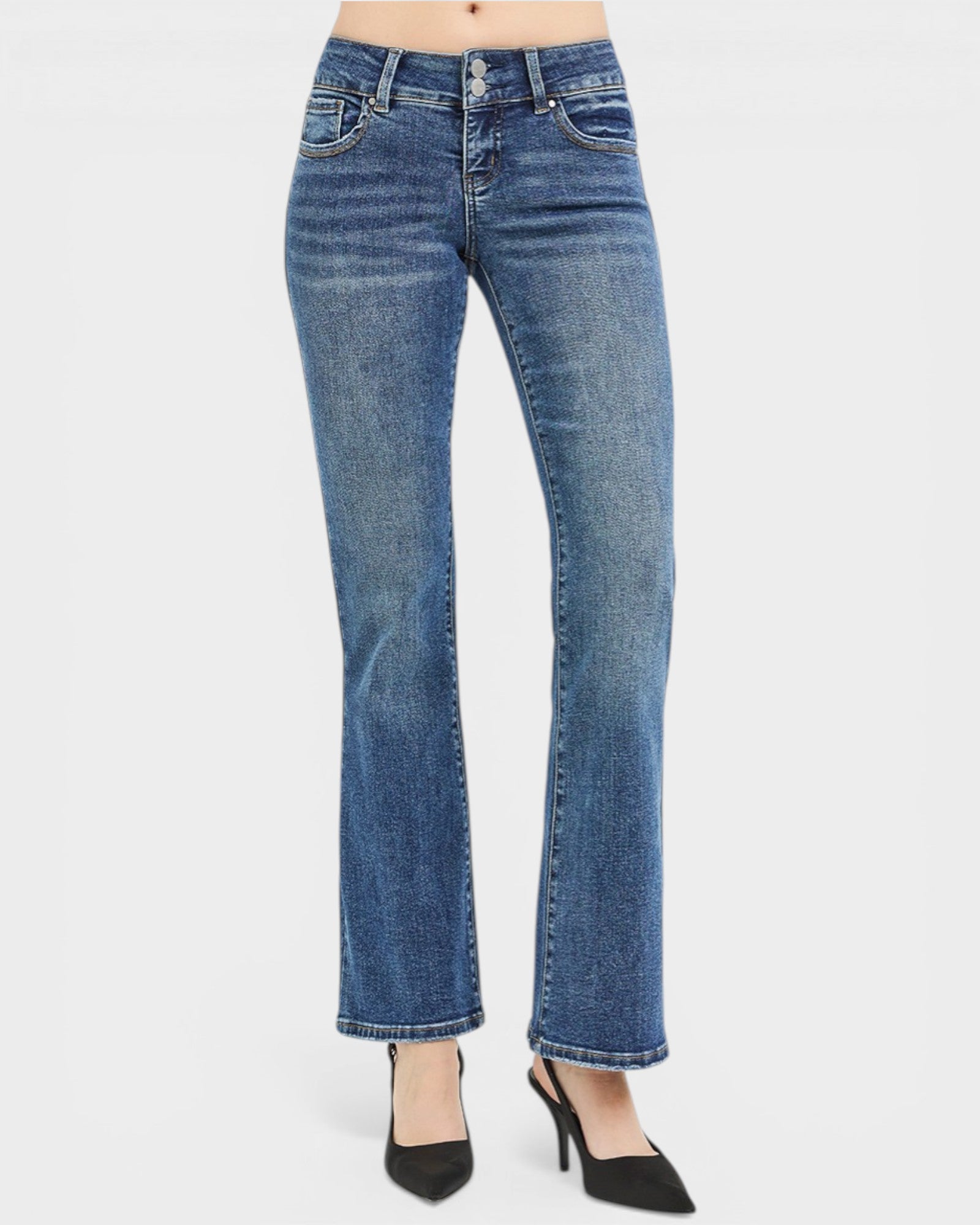 Blue jeans worn by a person on a white background