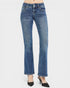 Blue jeans worn by a person on a white background