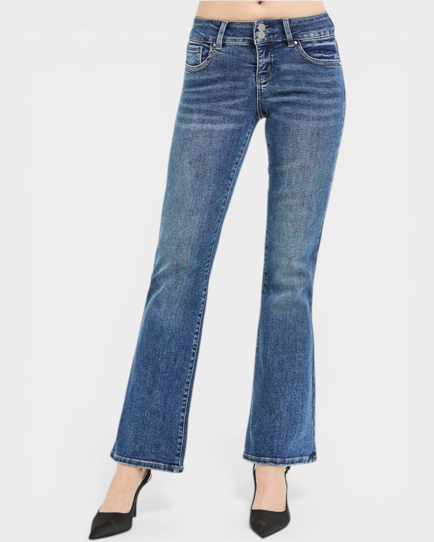 Blue jeans worn by a person on a white background