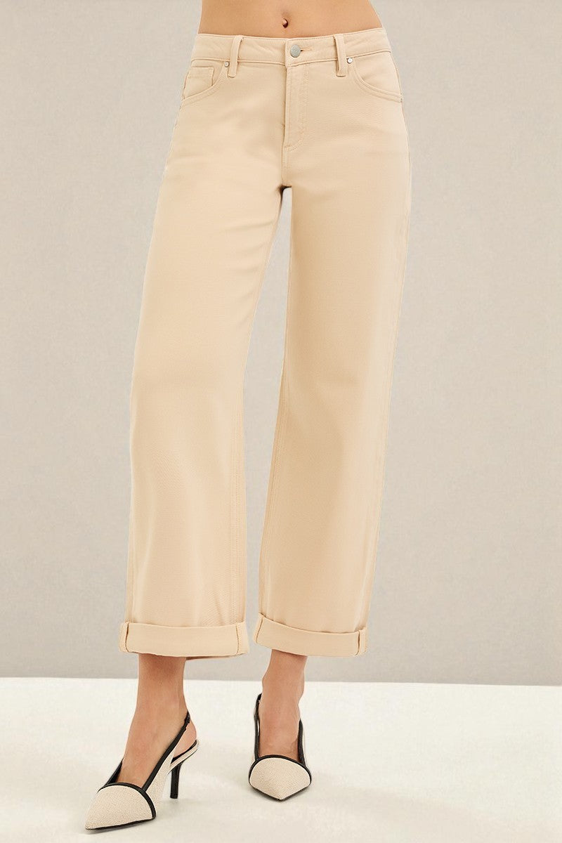Beige wide-leg pants worn by a person on a plain background