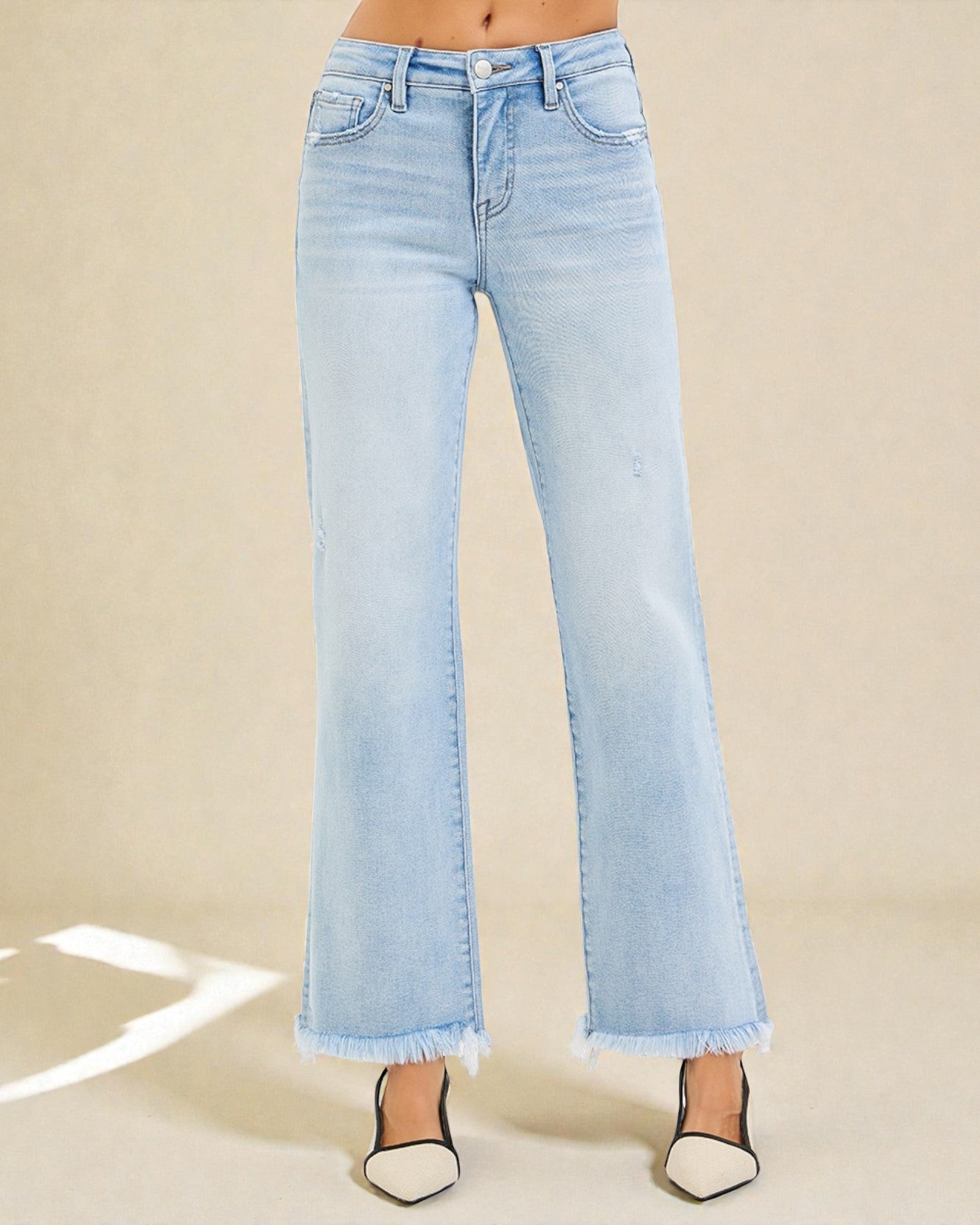 Light blue jeans on a beige background