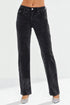 Black jeans worn by a person on a white background