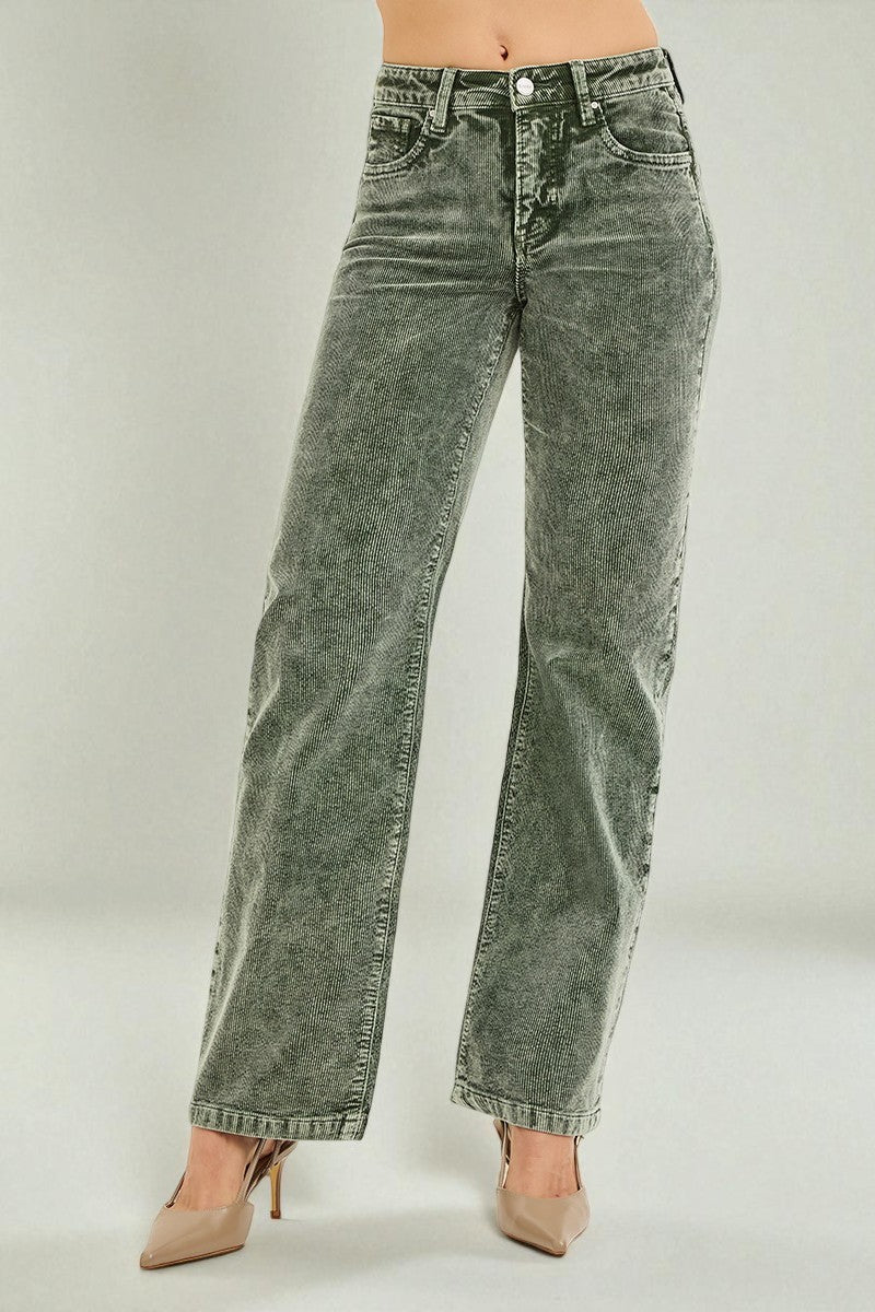 Green acid-wash jeans worn by a person on a plain background