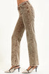 Brown acid-wash jeans worn by a person on a white background