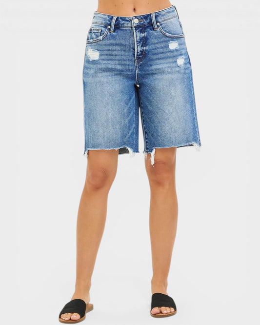 Denim shorts with slight distressing on a white background
