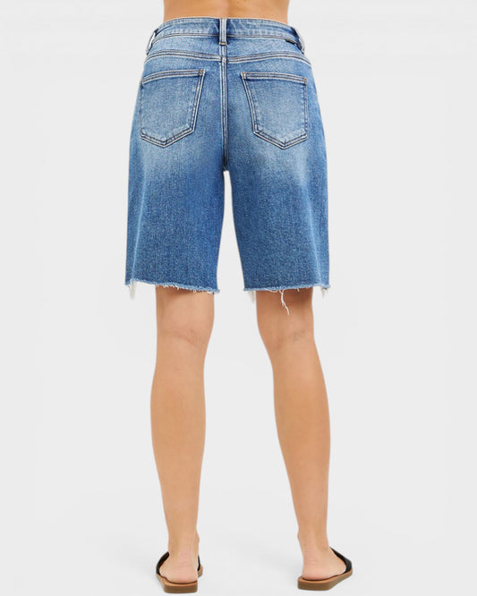 Blue denim shorts on a white background