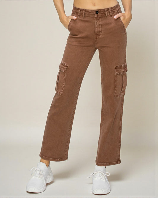Brown cargo pants worn by a person on a beige background