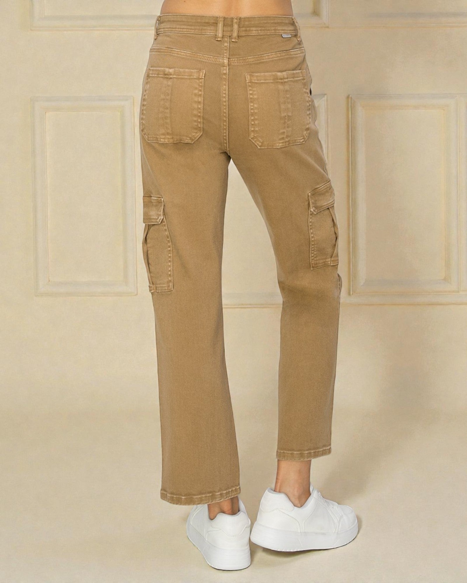 Tan cargo pants worn by a person on a beige background
