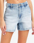 Light-wash blue denim shorts with a high-rise fit, worn by a model. The shorts feature a classic five-pocket design, belt loops, and a button closure.