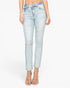 A model wearing light-wash blue distressed skinny jeans with a cropped ankle length, paired with clear high-heeled sandals, against a plain white background.