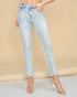 Light blue jeans worn by a person on a beige background