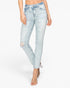 A model wearing light-wash blue distressed skinny jeans with ripped knees and cuffed hems, paired with clear high-heeled sandals, against a plain white background.