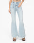 A model wearing light-wash blue denim flare jeans with a high waist and wide flared legs, paired with black strappy heels against a plain white background.