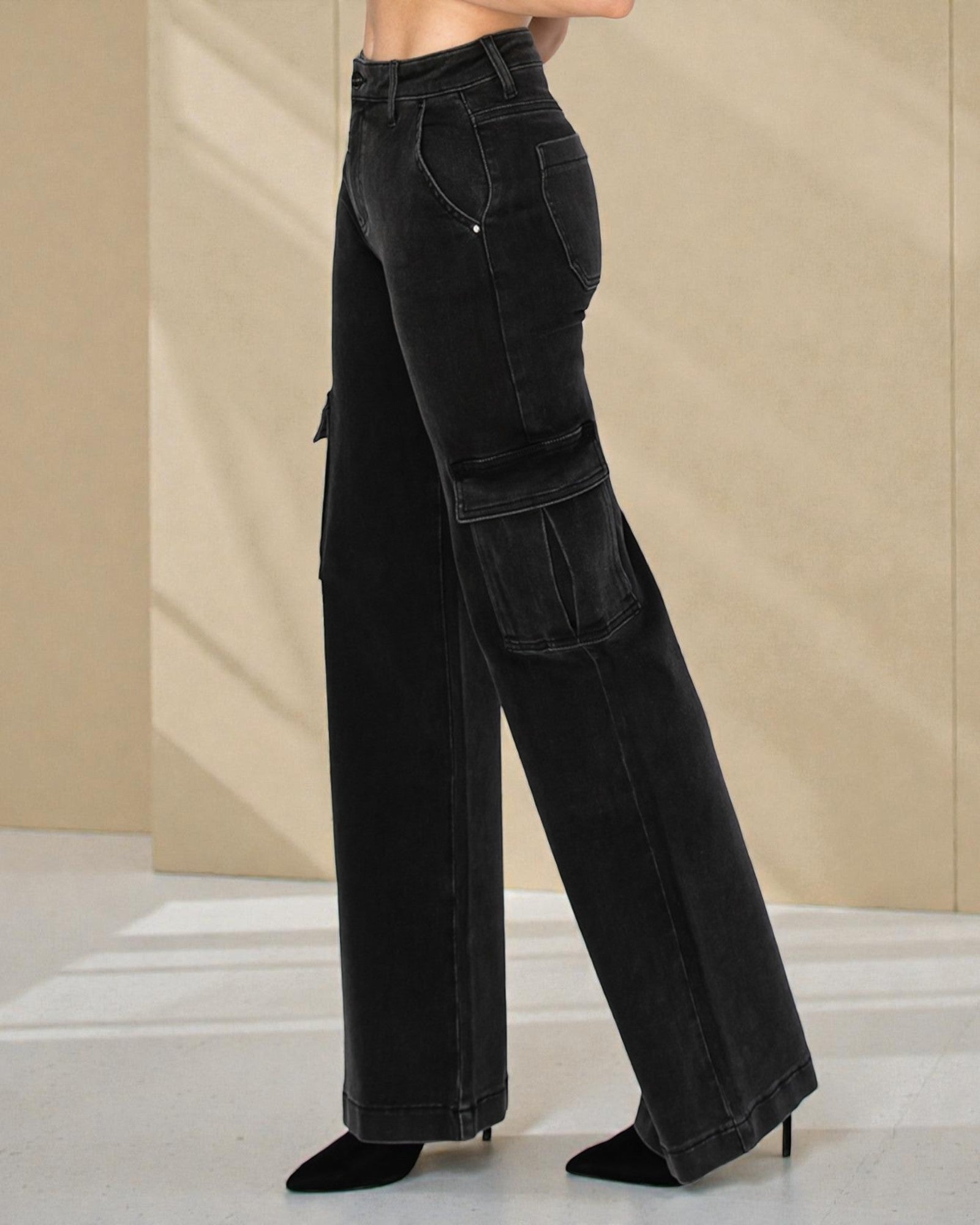 Black wide-leg jeans worn by a person on a neutral background