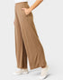 Brown wide-leg pants worn by a person on a white background