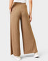 Brown wide-leg pants worn by a person on a light gray background