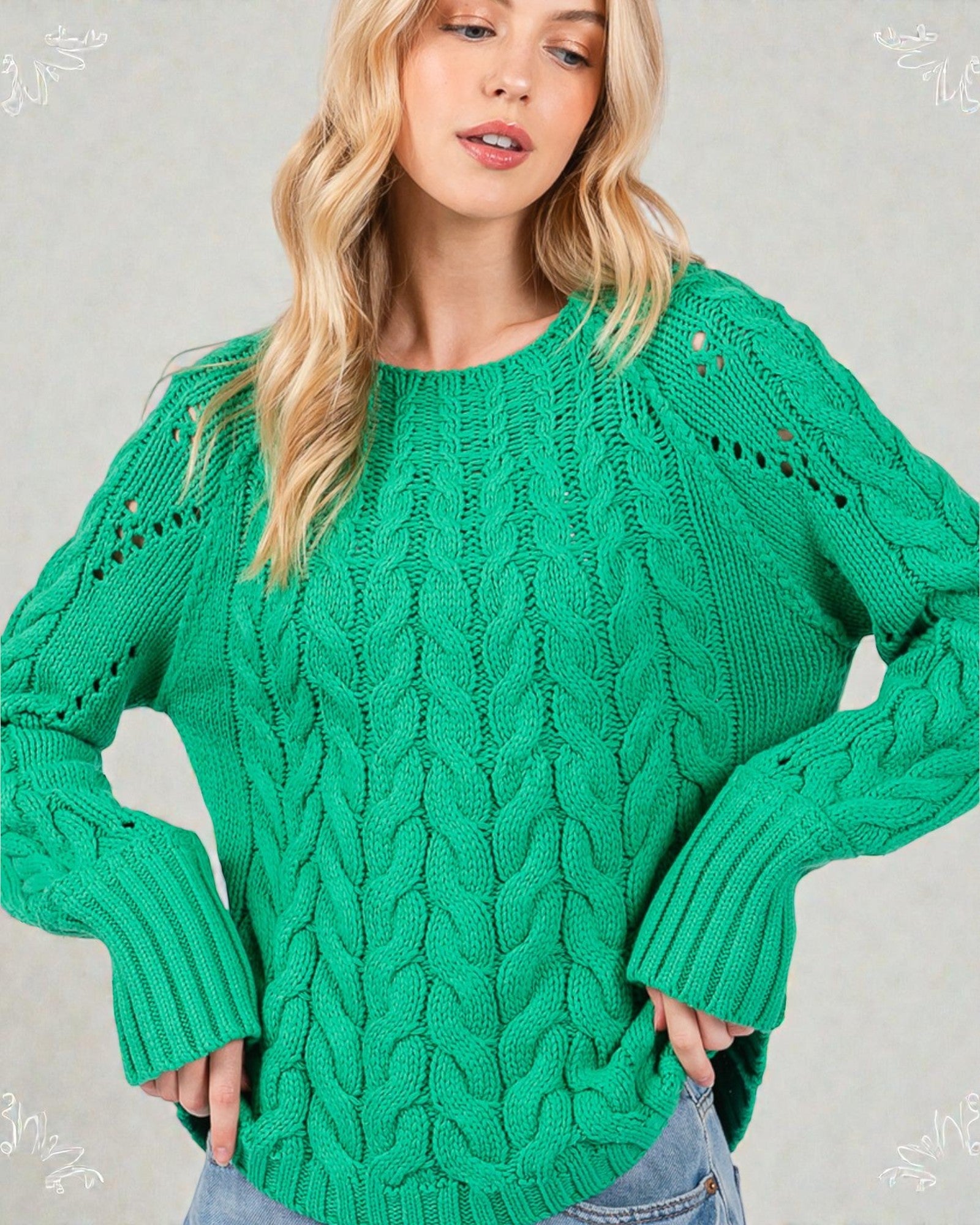 Woman wearing a green knitted sweater against a plain background