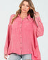Woman wearing a pink checkered shirt on a white background