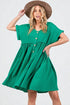 Woman wearing a green dress with a brown hat on a white background