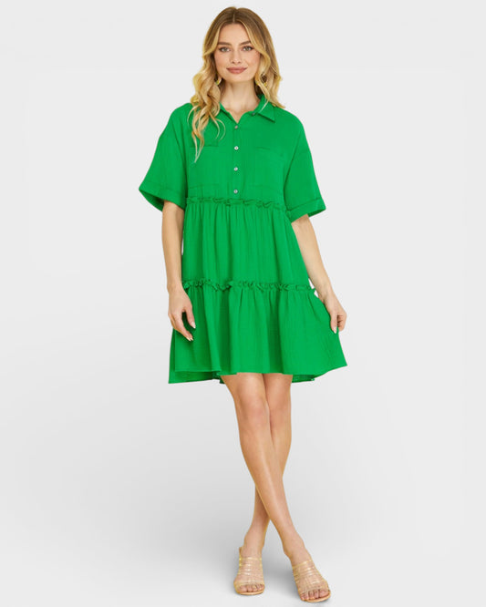 Woman wearing a green dress on a white background
